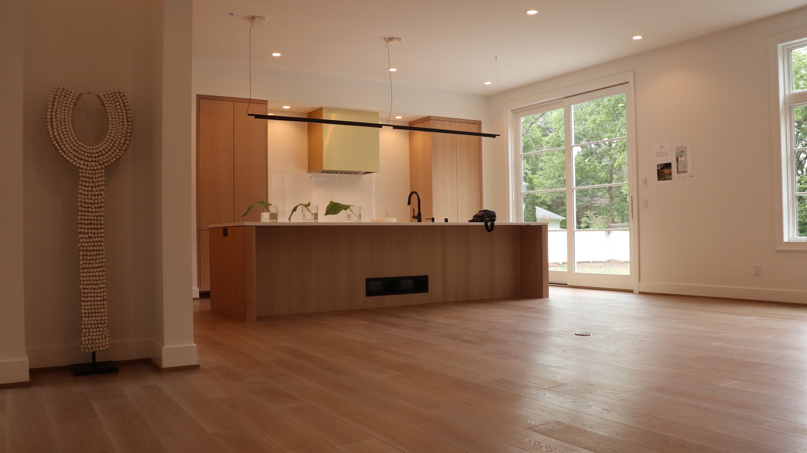 Freshly refinished hardwood floor in a bright living room